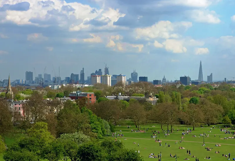 The London skyline seen over trees from Primrose Hill